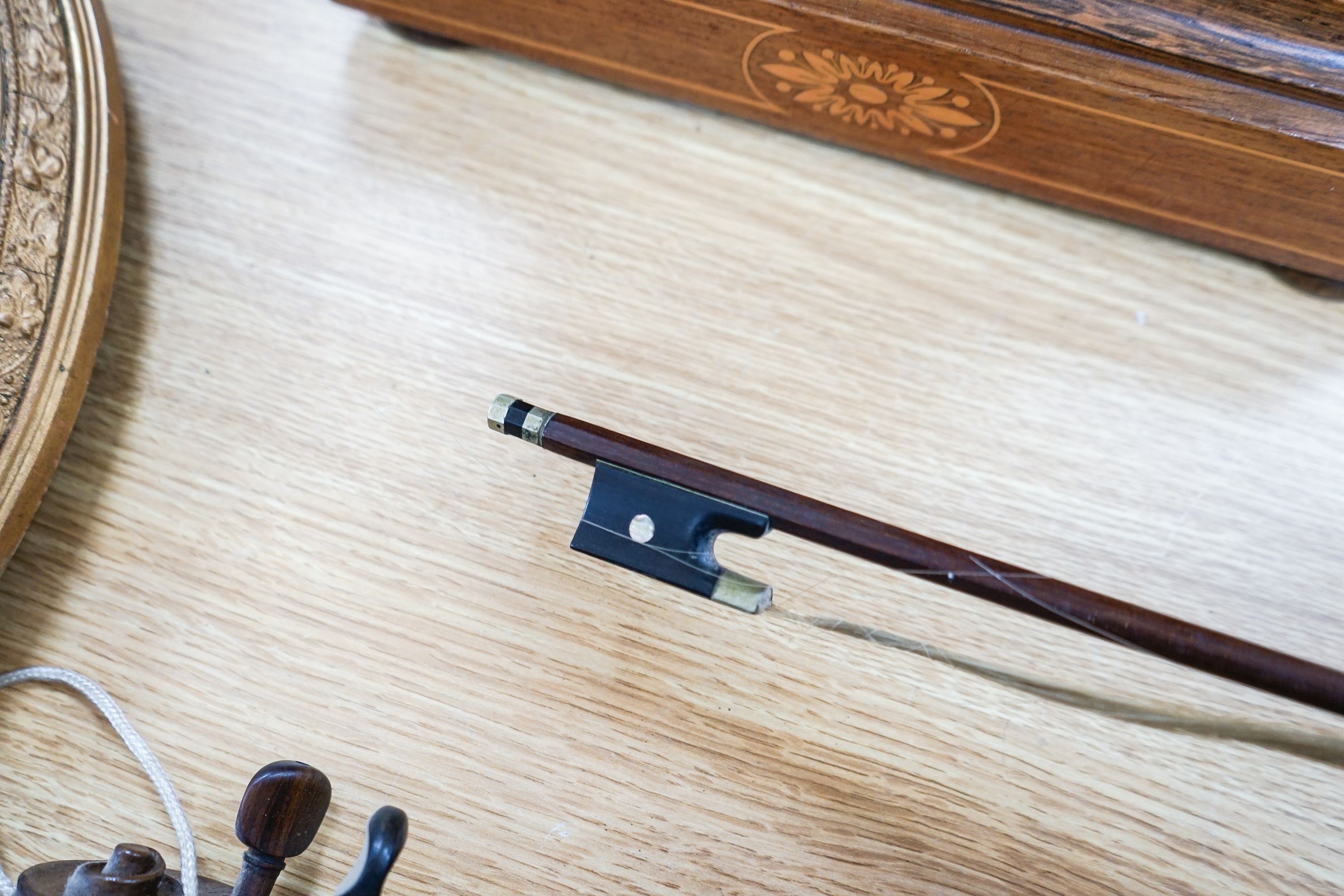 A violin labelled Francesco Ruggeri and a bow. Back of violin excluding button - 36cm